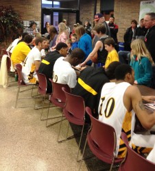 Knights Men Sign Autographs at Elementary Night
