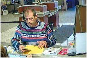 photo from surveillance video during O'Fallon, Ill bank robbery