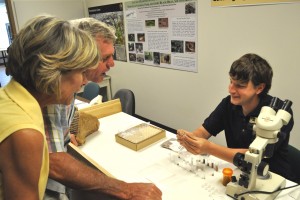 Derek Jurestousky, from The Mammoth Site, talks about the microfossils found in Persistence Cave to visitors at Wind Cave National Park. (NPS Photo)