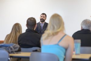 Travis O'Gorman, center, Chadron State College alumnus and judge of the 12th Judicial District Court, speaks to a justice studies class while he was on campus to receive his Distinguished Young Alumni Award during the 2016 Homecoming. (Photo by Daniel Binkard/Chadron State College) (Photo by Daniel Binkard/Chadron State College)